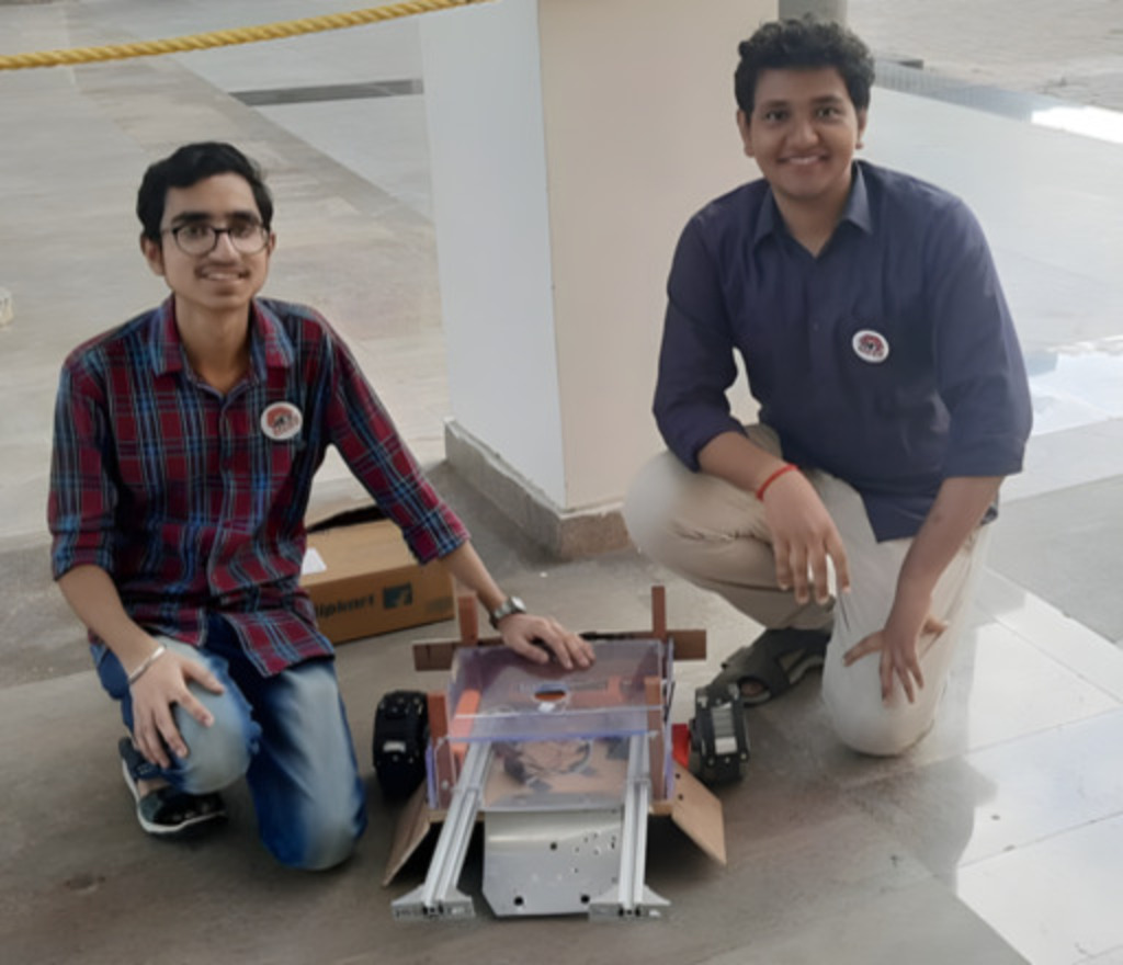 Samrat and Aravind with the robot, just few minutes before our first match.